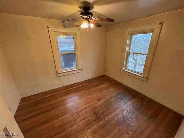 unfurnished room featuring ceiling fan and hardwood / wood-style floors