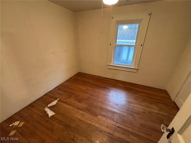 spare room with wood finished floors