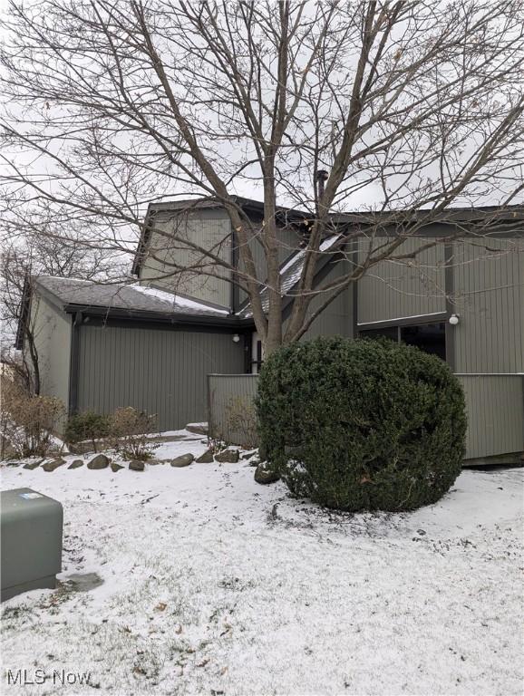 view of snow covered property