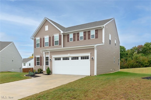 traditional home featuring driveway, a garage, and a front yard