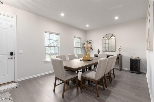 dining room featuring dark wood-style flooring, recessed lighting, and baseboards