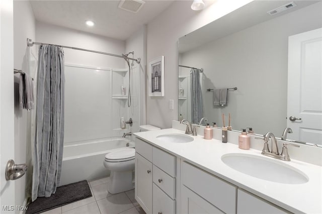 bathroom featuring shower / bathtub combination with curtain, visible vents, and a sink