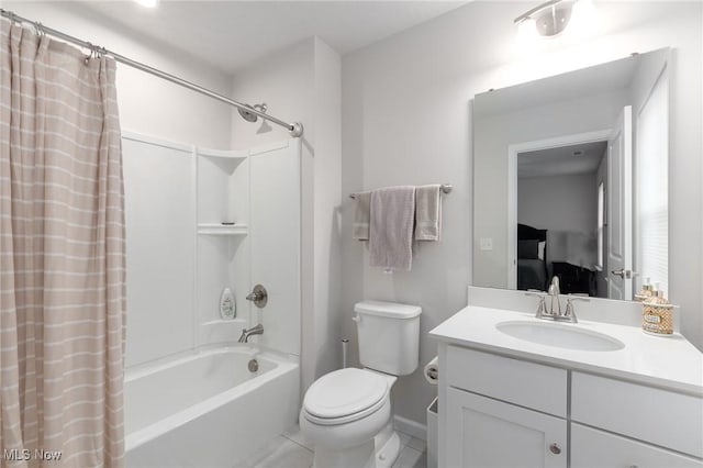 bathroom featuring toilet, tile patterned floors, ensuite bathroom, shower / bathtub combination with curtain, and vanity