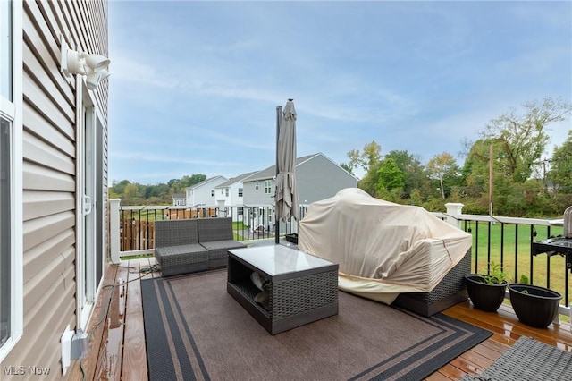 deck featuring an outdoor hangout area, a yard, and grilling area