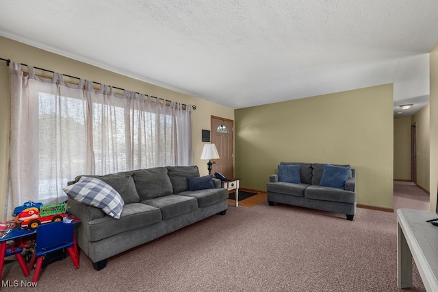 carpeted living room featuring a textured ceiling