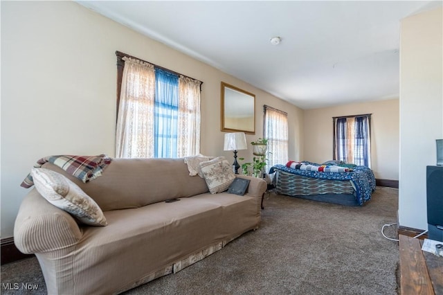 carpeted bedroom with baseboards