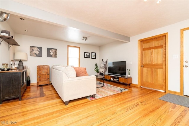 living area with recessed lighting, beamed ceiling, baseboards, and wood finished floors