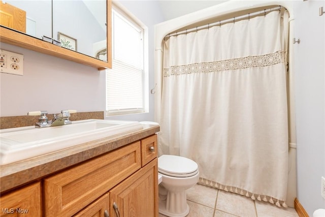 full bathroom with toilet, curtained shower, vanity, and tile patterned floors