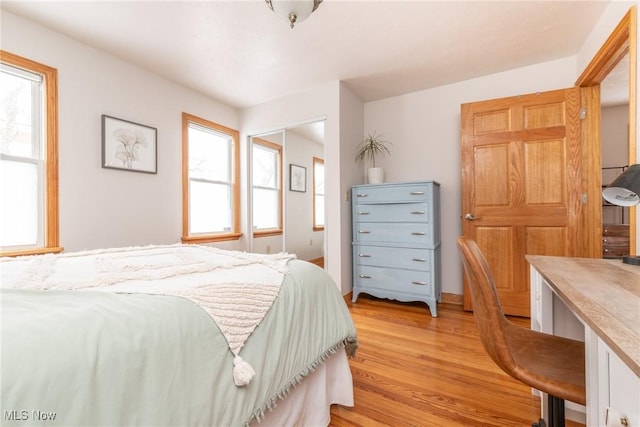 bedroom featuring light wood-style flooring