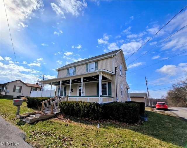 view of front of house featuring a porch and a front yard