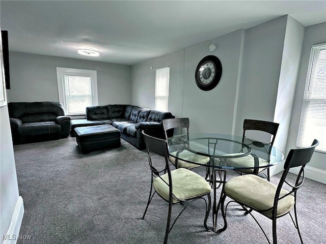 dining area with carpet floors, plenty of natural light, and baseboards