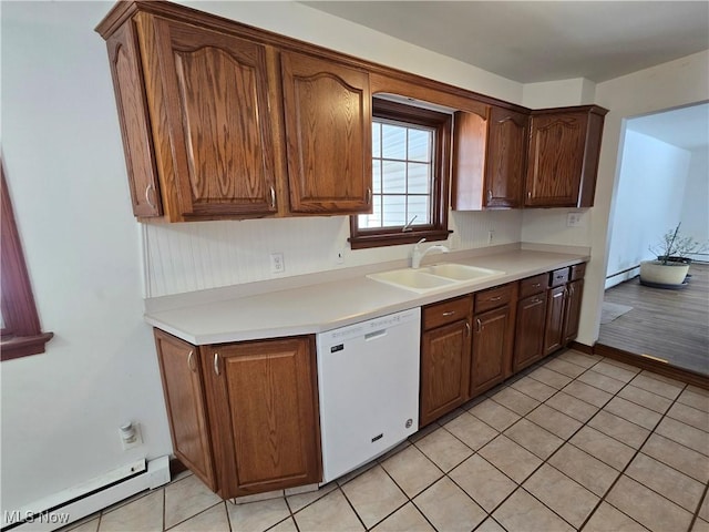 kitchen featuring baseboard heating, a sink, light countertops, and white dishwasher