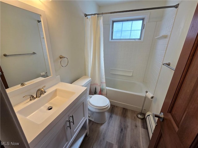 bathroom with a baseboard heating unit, toilet, shower / bath combo, wood finished floors, and vanity