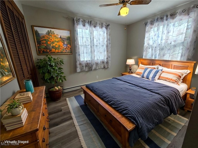 bedroom featuring ceiling fan and wood finished floors