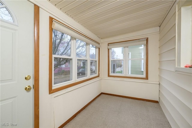 unfurnished sunroom featuring a wealth of natural light