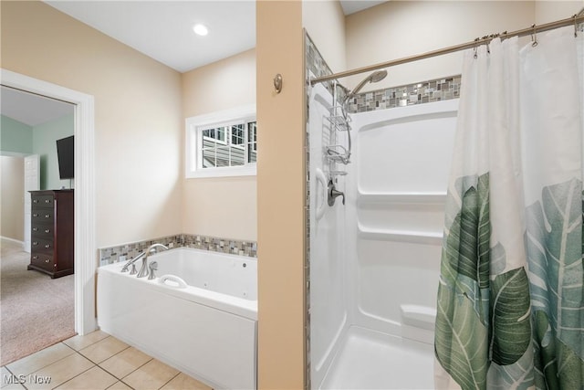 bathroom featuring recessed lighting, a shower stall, a bath, and tile patterned floors