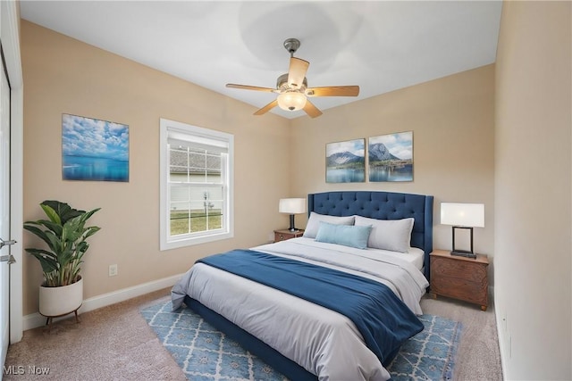 bedroom with ceiling fan, carpet floors, and baseboards