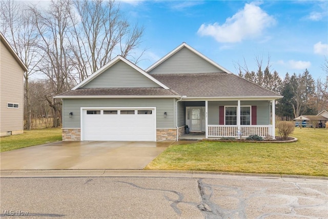 view of front of home with a shingled roof, covered porch, a garage, stone siding, and a front lawn