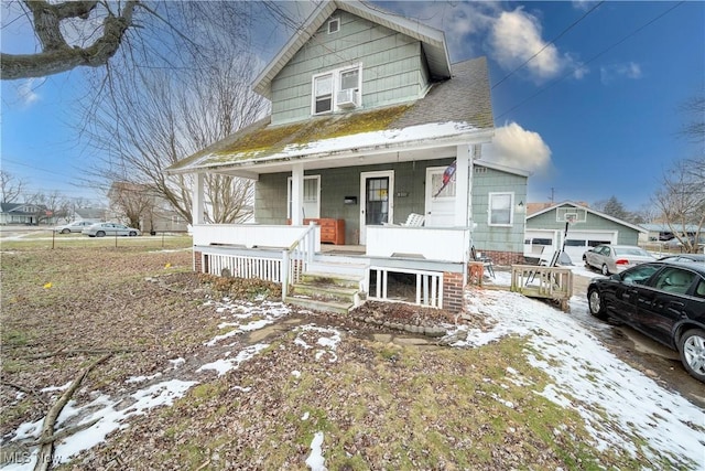 bungalow featuring covered porch and cooling unit