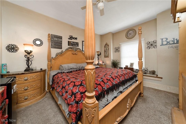 bedroom with ceiling fan, carpet flooring, and baseboards