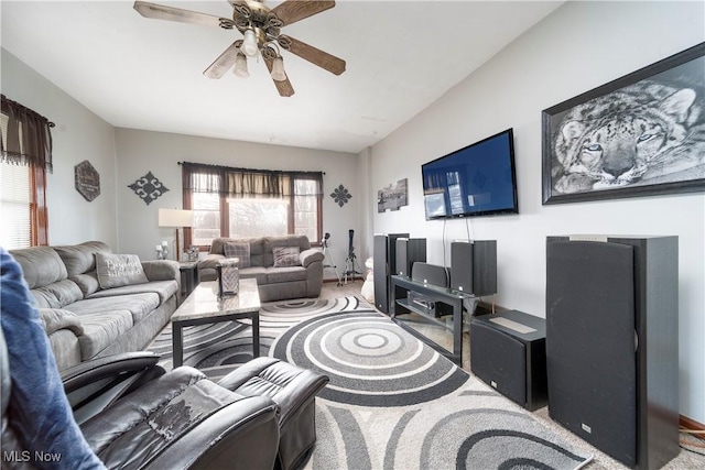 living room with carpet floors and a ceiling fan