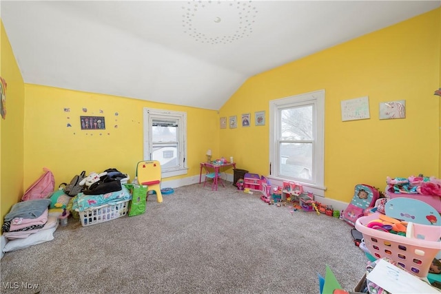 game room featuring a healthy amount of sunlight, baseboards, vaulted ceiling, and carpet flooring