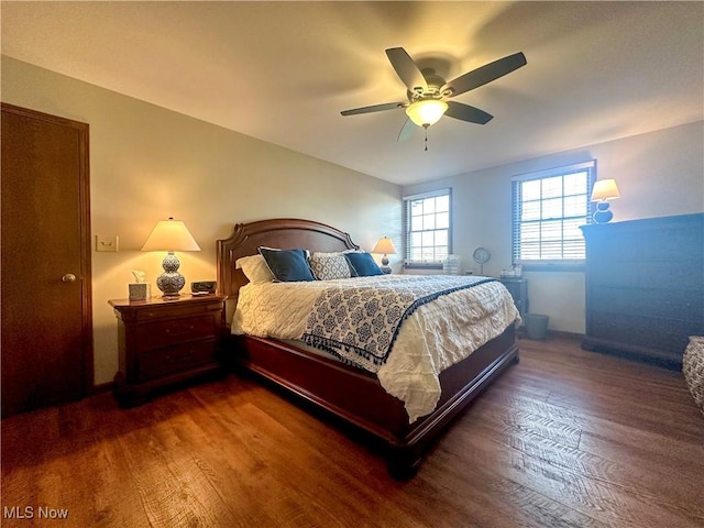 bedroom featuring dark wood-style floors and ceiling fan