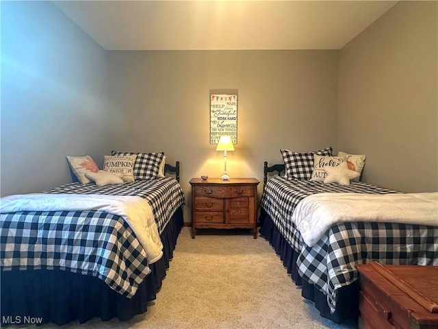 bedroom with light colored carpet