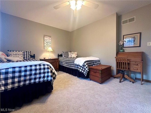 bedroom featuring light carpet, ceiling fan, and visible vents