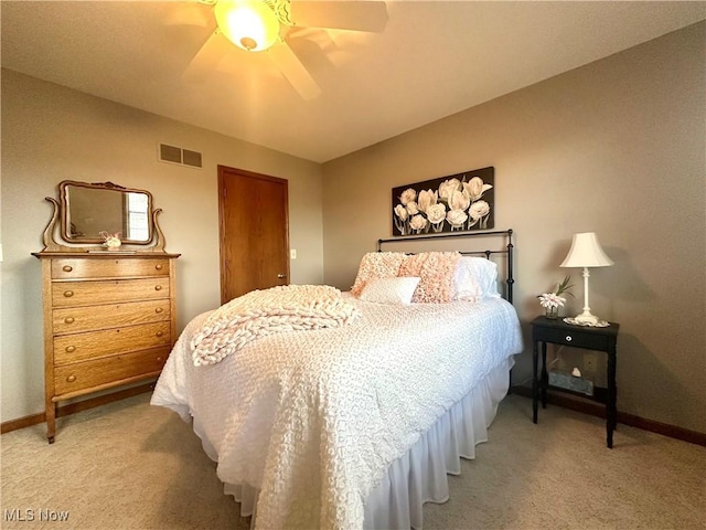 bedroom with a ceiling fan, carpet, visible vents, and baseboards