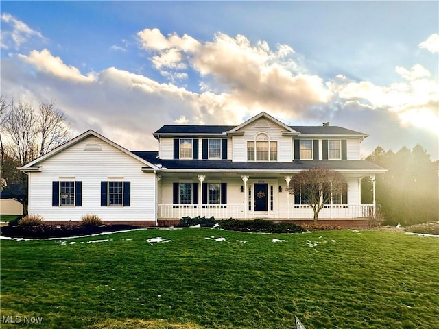 view of front of home with a front lawn and a porch