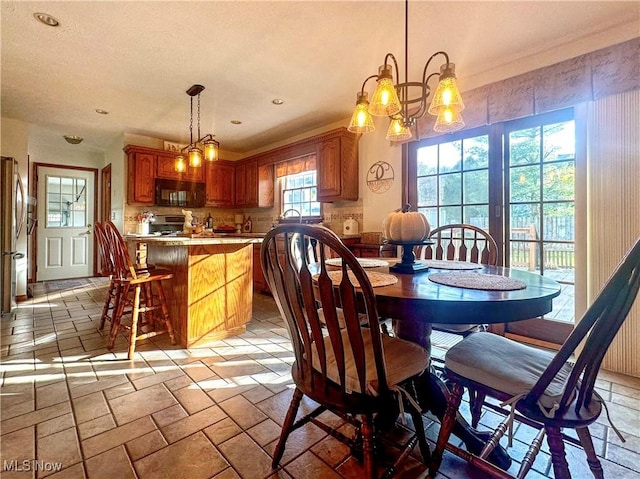 dining room featuring recessed lighting and stone tile floors