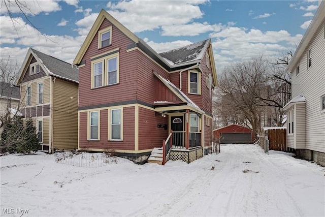 view of front of property with a detached garage