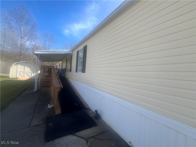 view of property exterior with an outbuilding and a storage shed