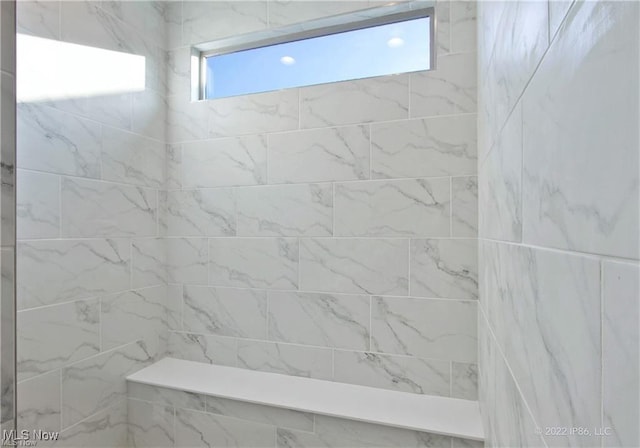 full bath with tiled shower