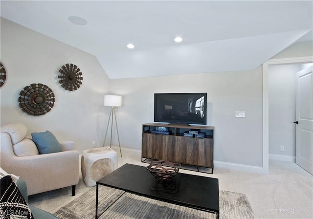 living area featuring lofted ceiling, recessed lighting, baseboards, and light colored carpet