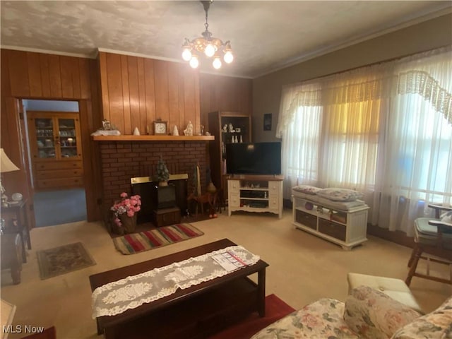 living area with wooden walls, ornamental molding, and a notable chandelier