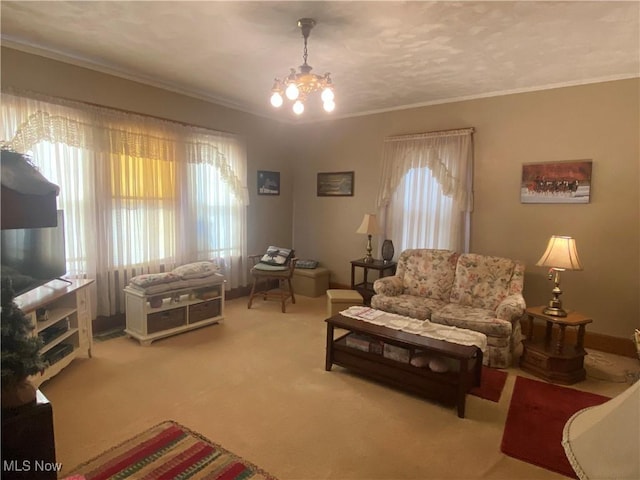 living area featuring carpet floors, crown molding, baseboards, and a notable chandelier