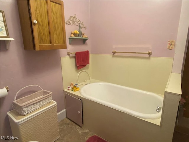 full bathroom with a bath