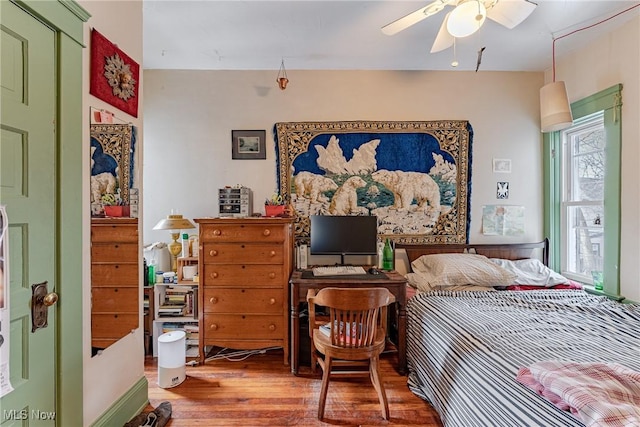 bedroom featuring ceiling fan and wood finished floors