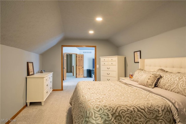 bedroom featuring light carpet, baseboards, a textured ceiling, and lofted ceiling