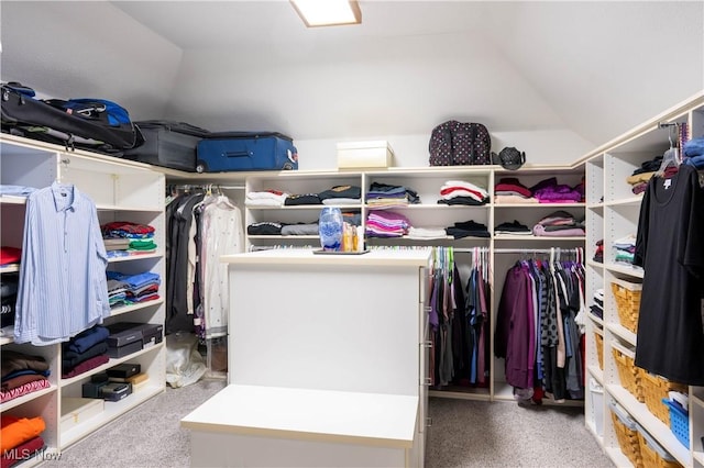 walk in closet featuring vaulted ceiling