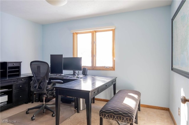 home office featuring light colored carpet and baseboards