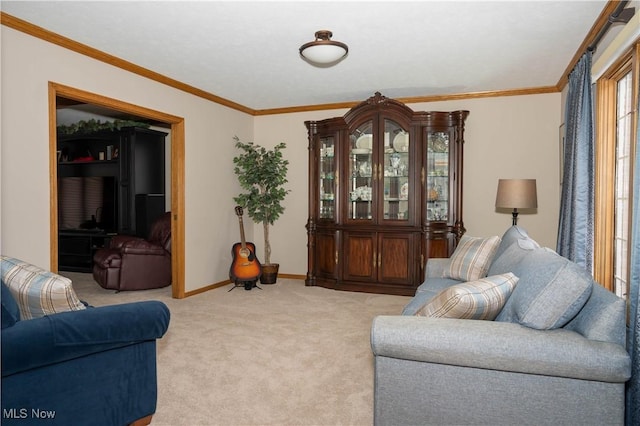 carpeted living area featuring baseboards and ornamental molding