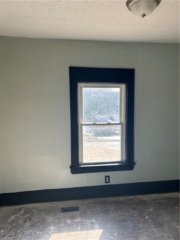 11617 Ely, Cleveland, OH 44120 - room details with a textured ceiling and baseboards