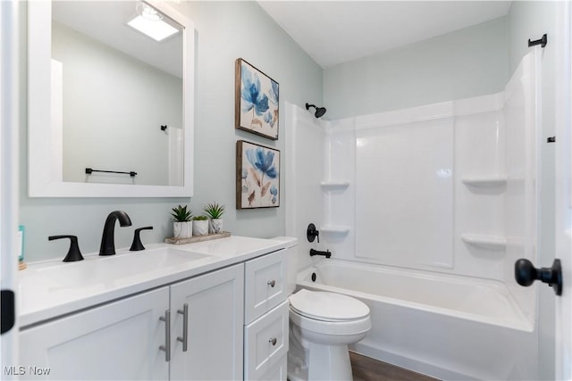 full bath featuring vanity, toilet, and shower / bathtub combination