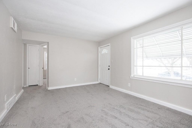 interior space featuring visible vents and baseboards