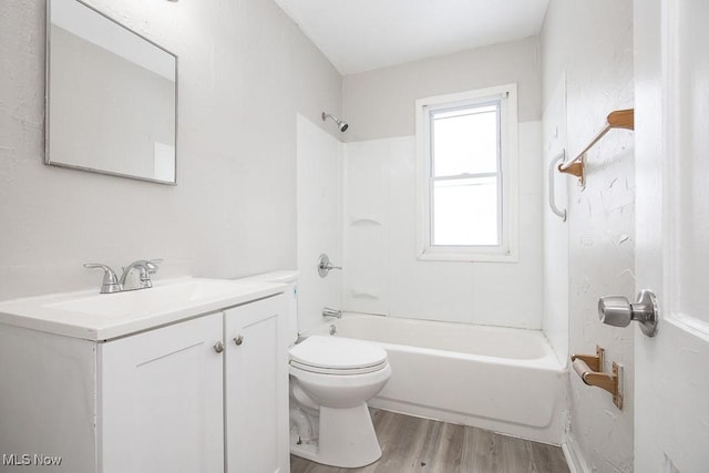 bathroom featuring shower / bath combination, vanity, toilet, and wood finished floors