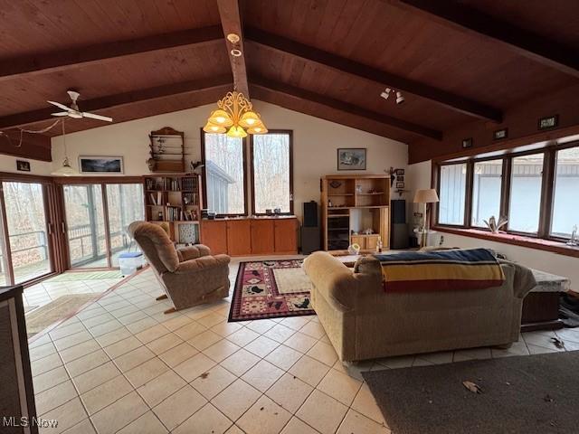 living area featuring a ceiling fan, wooden ceiling, light tile patterned flooring, and lofted ceiling with beams