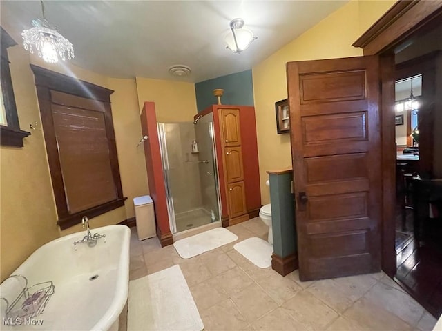 601 W 3rd St, Williamstown, WV 26187 - bathroom featuring a shower stall, a freestanding bath, and tile patterned flooring